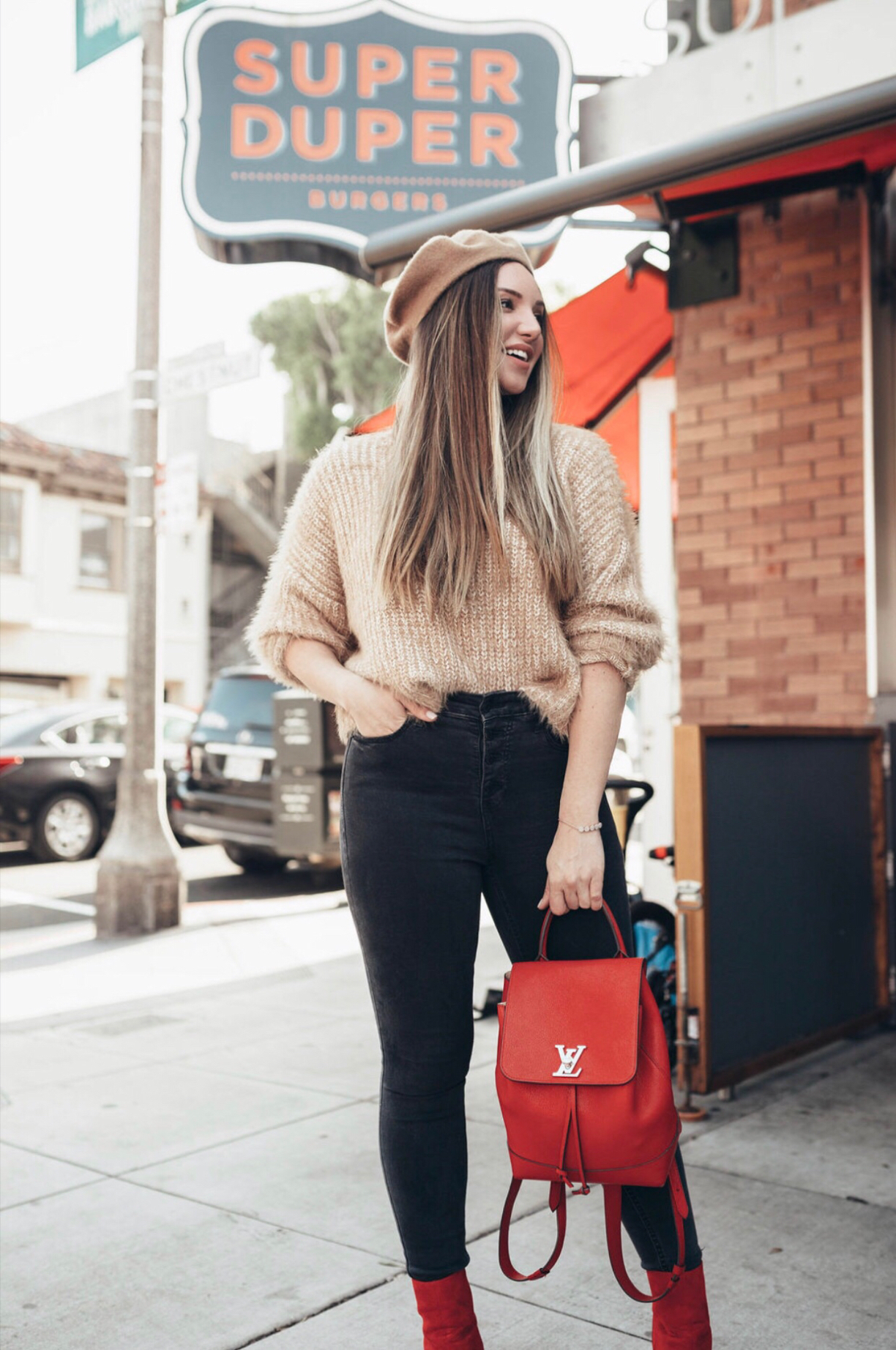  BEST DENIM BLACK FRIDAY DEALS FOR 2019 by popular San Francisco life and style blog Just Add Glam: image of a woman outside wearing a pair of black denim jeans.