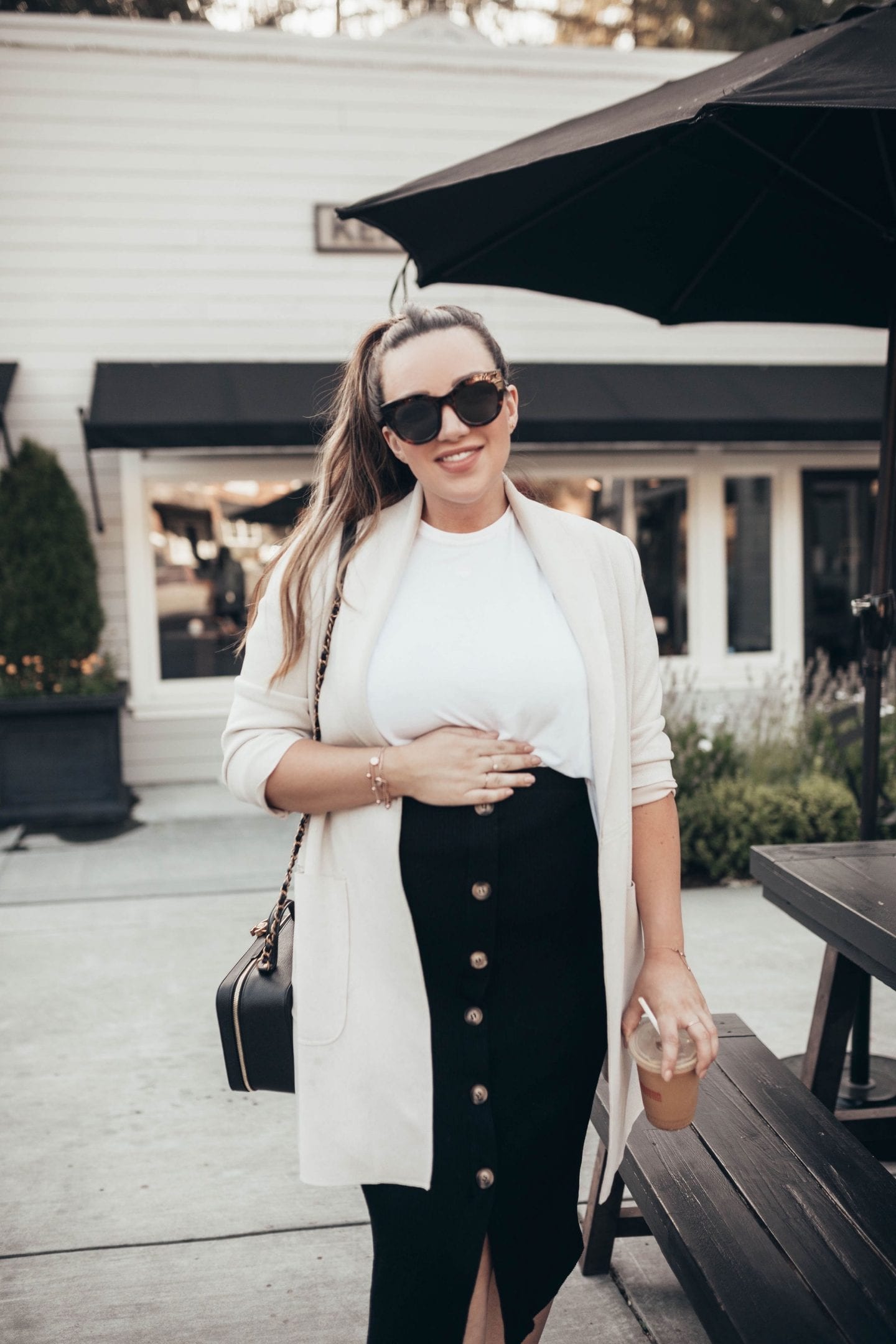 Maternity Style for Each Trimester by popular California fashion blog, Just Add Glam: image of a woman wearing a Asos Mamalicious maternity jersey button through midi skirt.