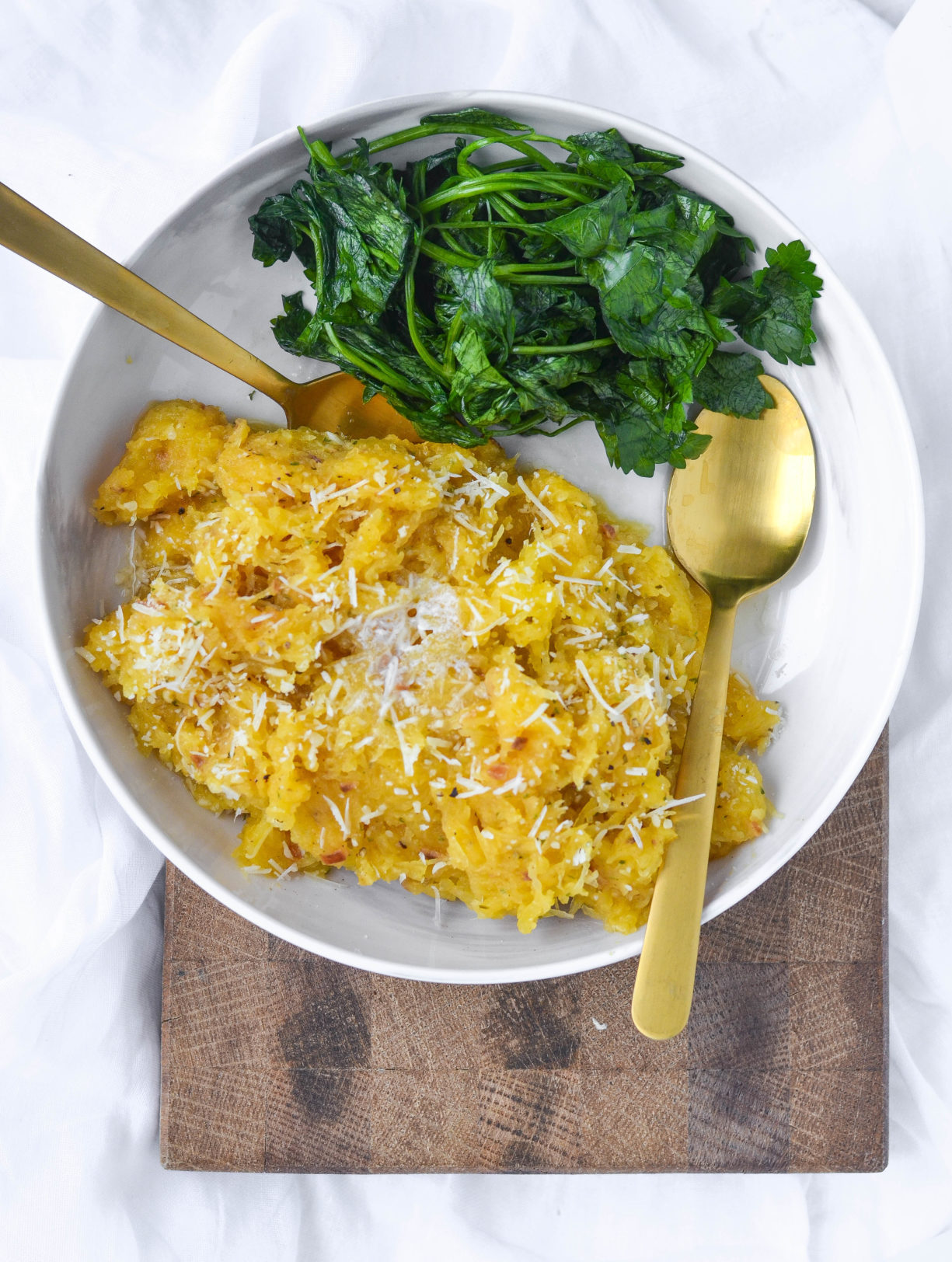 Slow-Cooker-Garlic-Parmesan-Spaghetti-Squash-Just-Add-Glam | HEALTHY KETO CROCKPOT RECIPES TO EASE YOU INTO THE NEW YEAR by popular San Francisco life and style blog, Just Add Glam: image of slow cooker garlic parmesan spaghetti squash.  