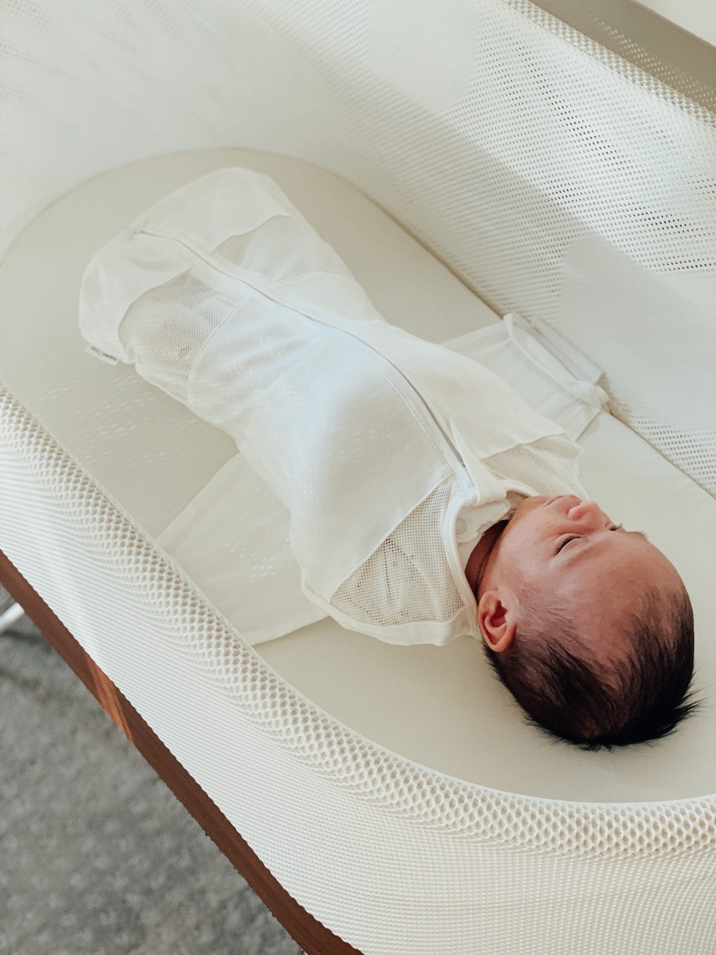 Baby Snoo Bassinet Review by popular San Francisco life and style blog, Just Add Glam: image of a baby laying in Snoo Bassinet. 