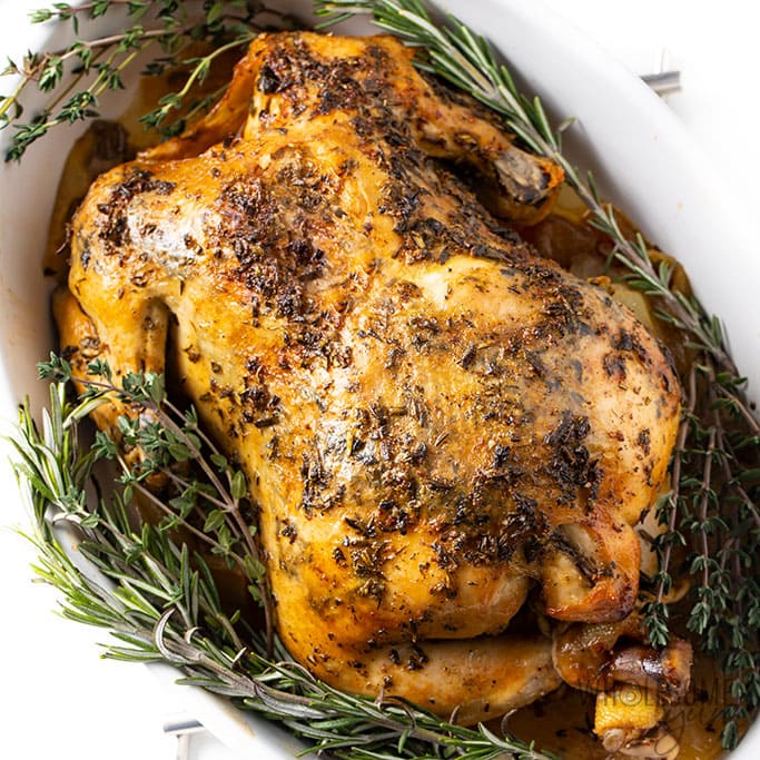 wholesomeyum-crock-pot-whole-chicken-recipe-just-add-glam | HEALTHY KETO CROCKPOT RECIPES TO EASE YOU INTO THE NEW YEAR by popular San Francisco life and style blog, Just Add Glam: image of Crockpot whole chicken recipe with herb butter.