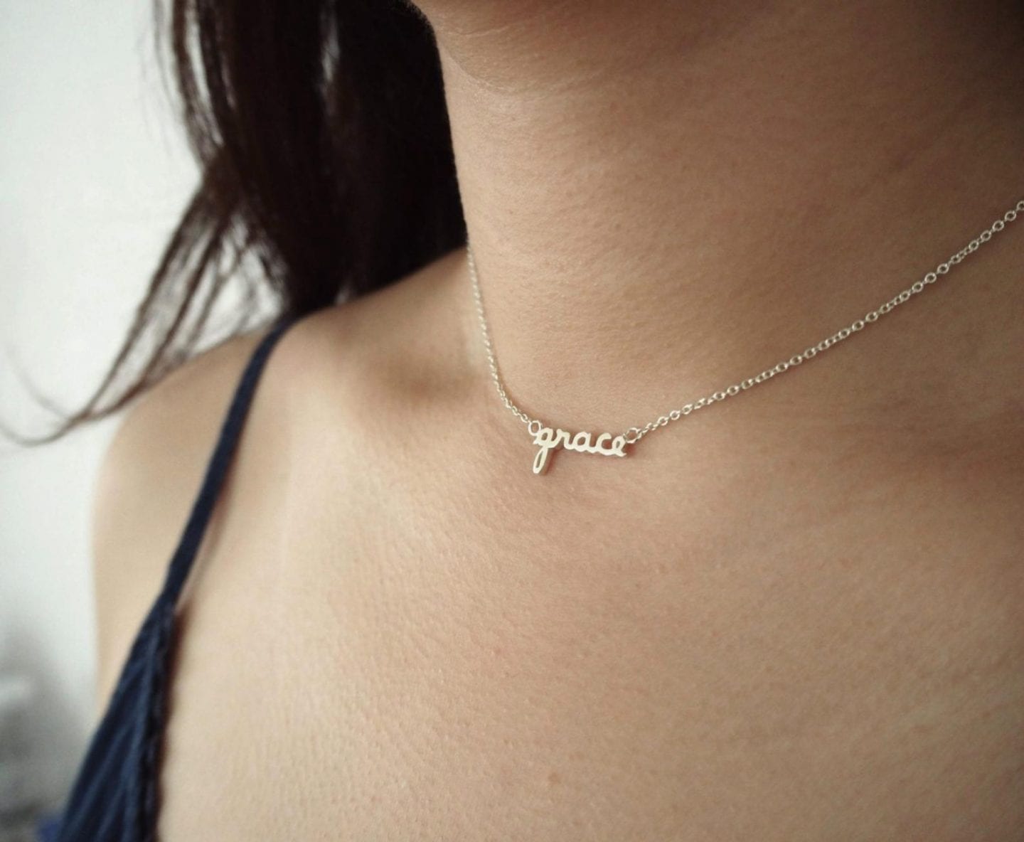 Initial Jewelry by popular San Francisco fashion blog, Just Add Glam: image of a tiny name necklace.
