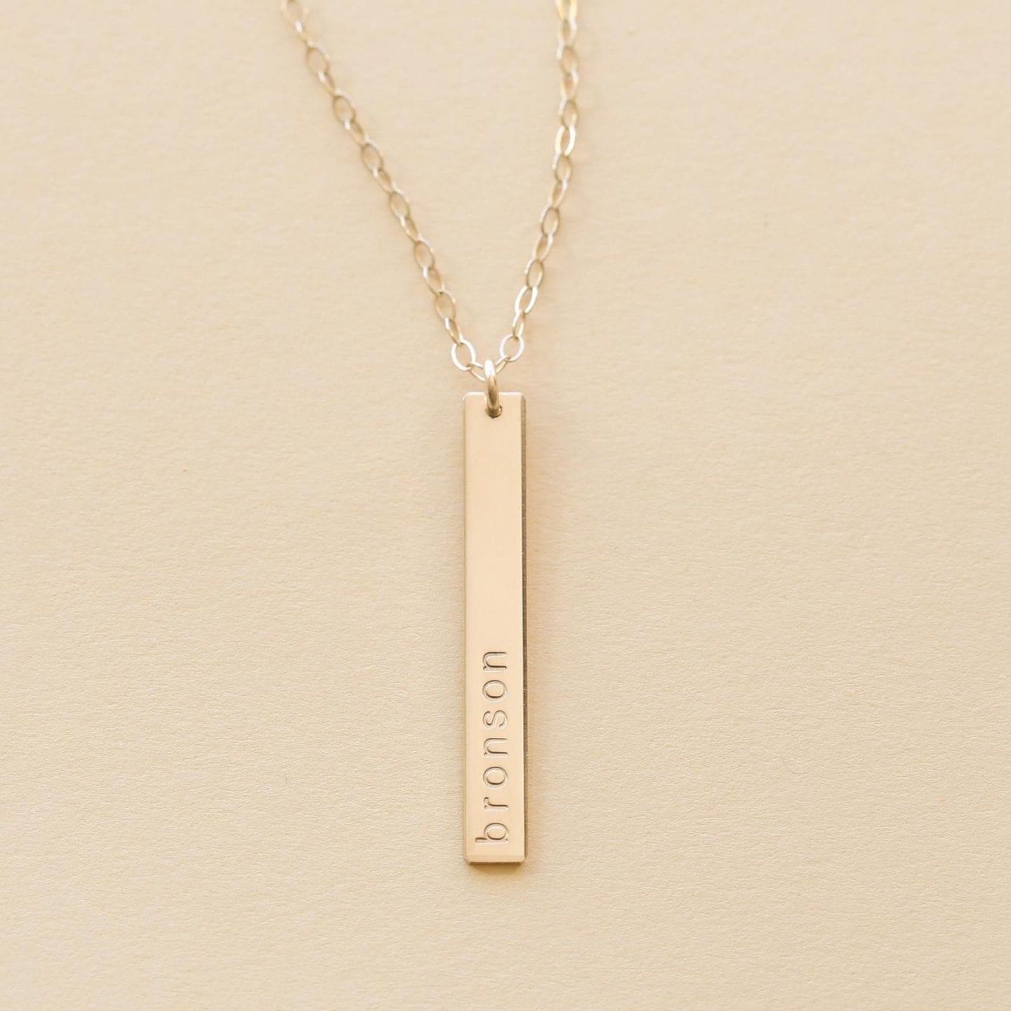 Initial Jewelry by popular San Francisco fashion blog, Just Add Glam: image of a personalized gold bar necklace. 