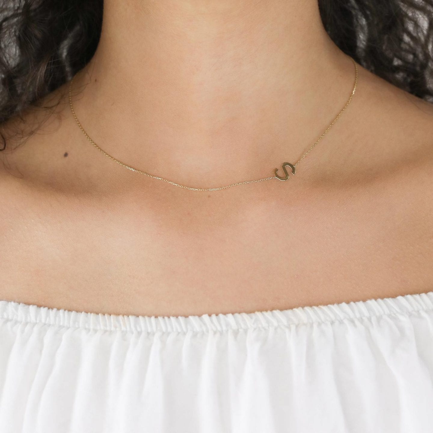Initial Jewelry by popular San Francisco fashion blog, Just Add Glam: image of a 14k gold initial necklace.