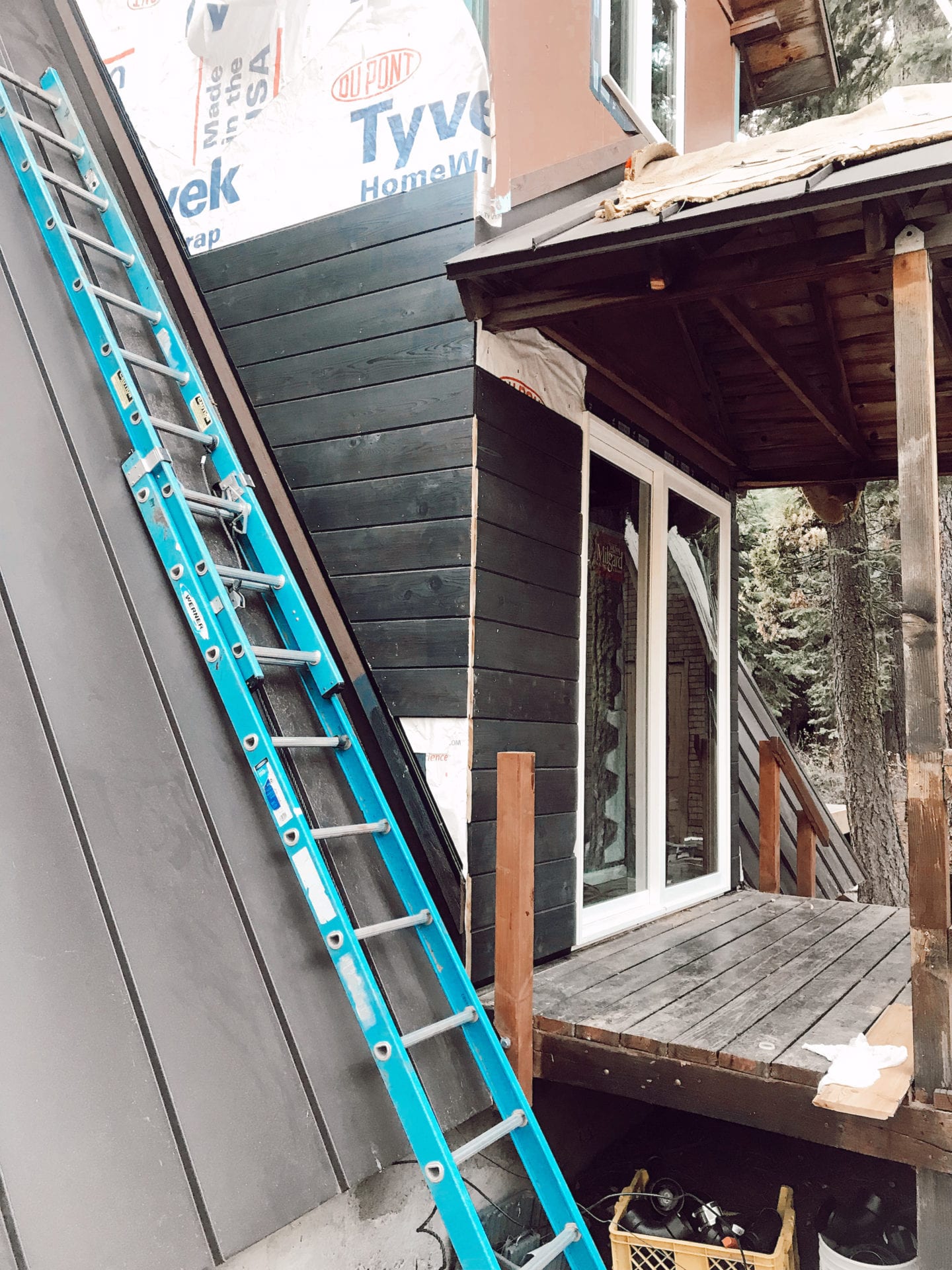 milgard windows | Milgard Windows by popular San Francisco life and style blog, Just Add Glam: image of Milgard Windows being installed in a A-Frame cabin. 