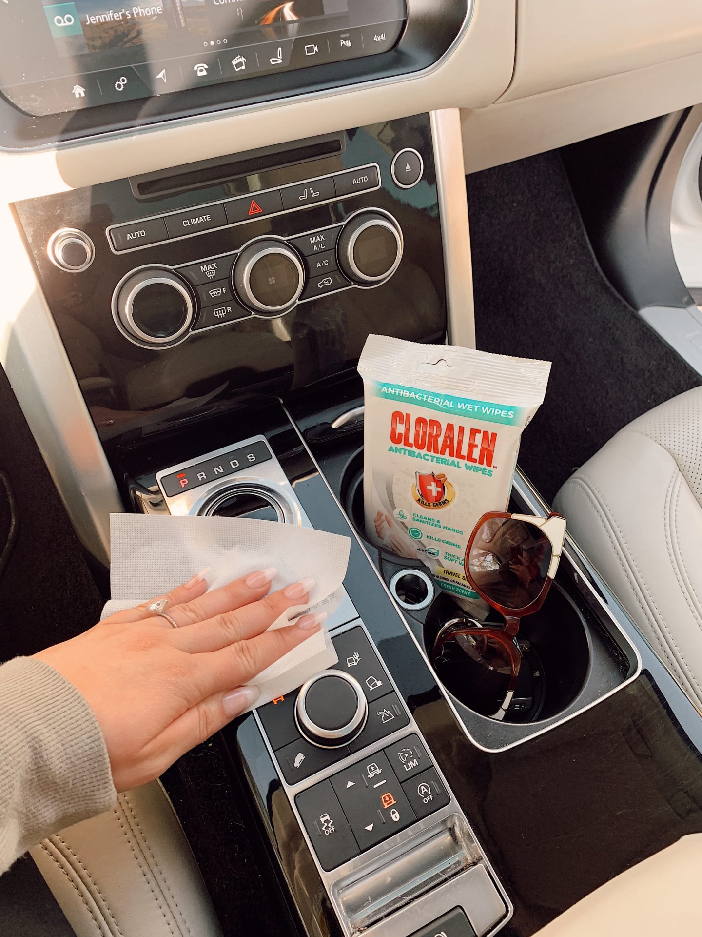 CLORALEN wipes |Spring Cleaning Hacks by popular San Francisco lifestyle blog, Just Add Glam: image of a woman using Cloralen wipes in her car. 